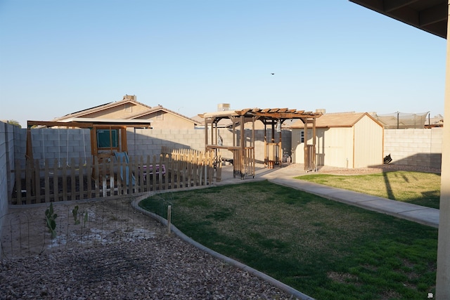 view of yard featuring a storage shed, a patio, a fenced backyard, an outdoor structure, and a pergola