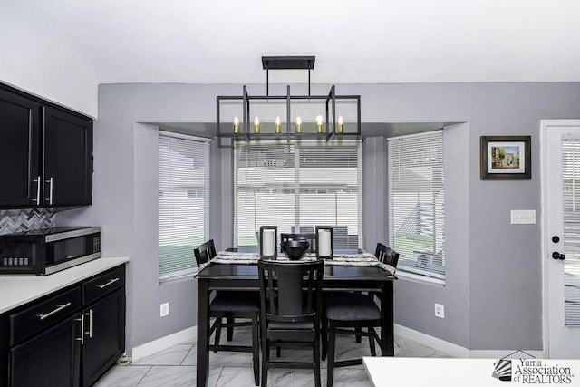 dining room featuring a notable chandelier