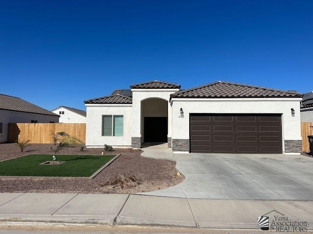 view of front of house with a front lawn and a garage