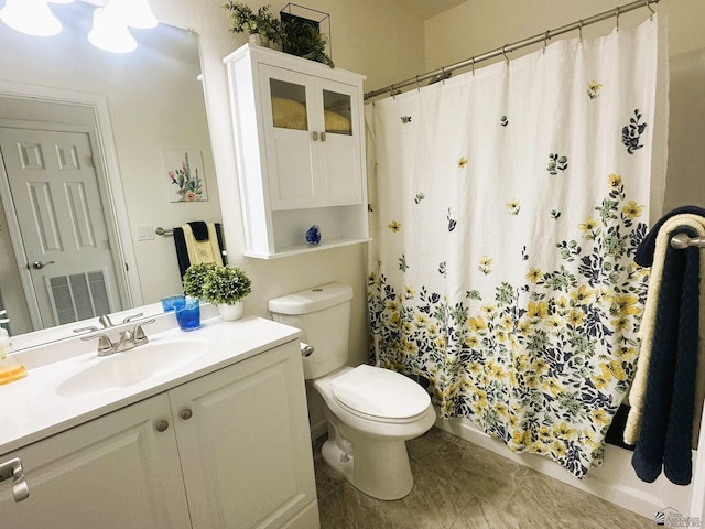 bathroom with toilet, visible vents, a shower with shower curtain, and vanity