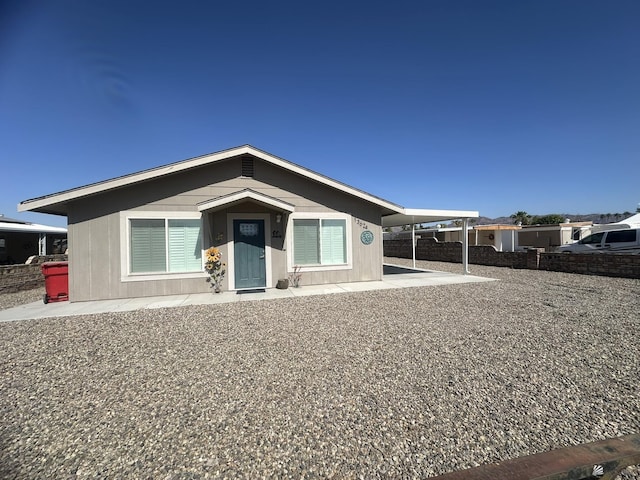 view of front of property with a carport