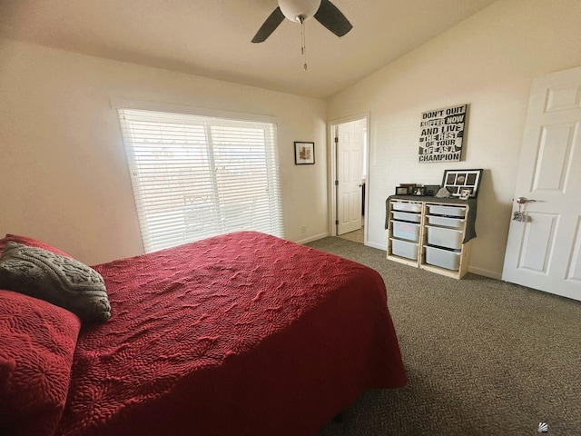 bedroom featuring carpet floors, vaulted ceiling, baseboards, and ceiling fan