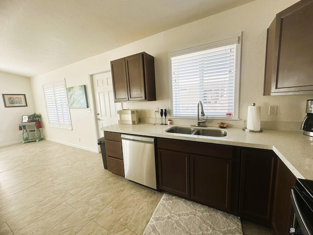 kitchen with dark brown cabinetry, range, dishwasher, light countertops, and a sink