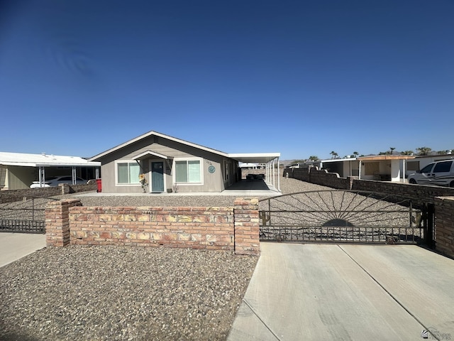 view of front of property featuring a gate and fence