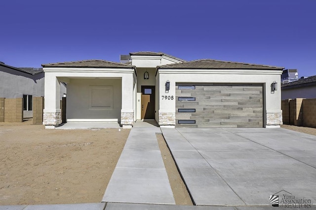 prairie-style home featuring a garage