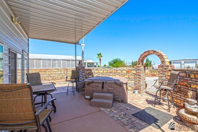 view of patio / terrace featuring a hot tub