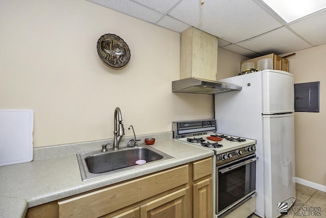 kitchen with a paneled ceiling, sink, white range with gas stovetop, electric panel, and wall chimney range hood