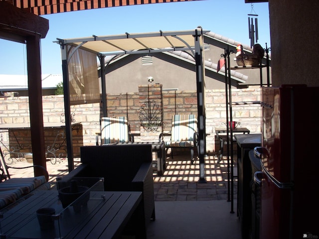 view of patio featuring a pergola