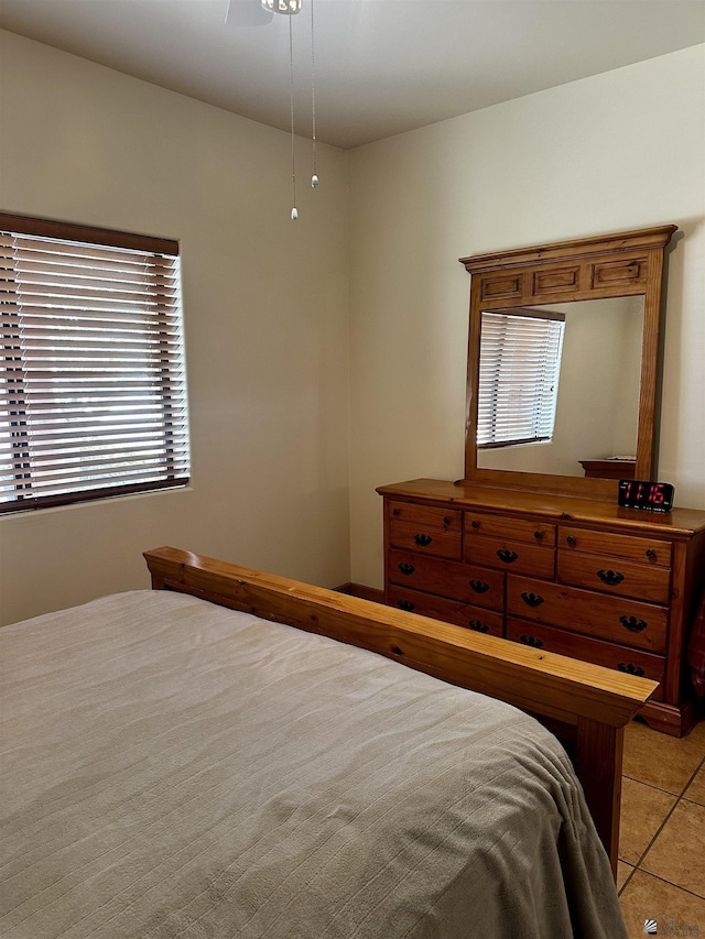 bedroom featuring ceiling fan and light tile patterned floors