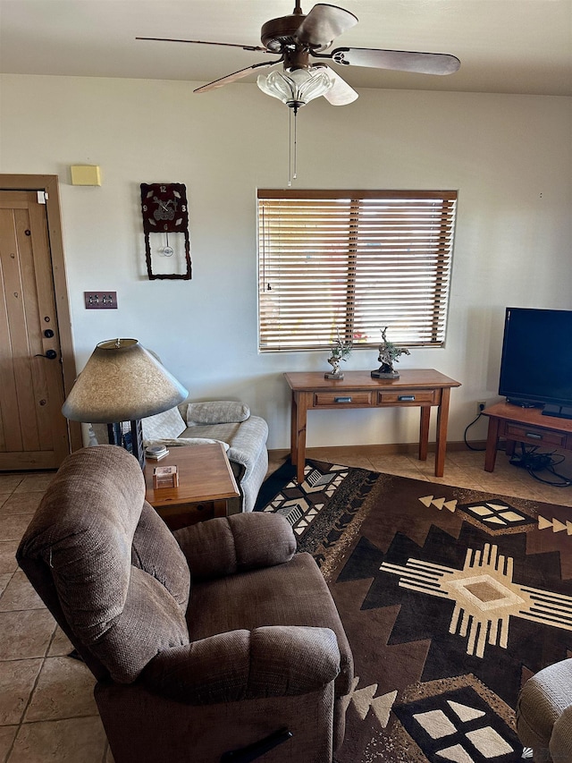 living room with ceiling fan and light tile patterned floors