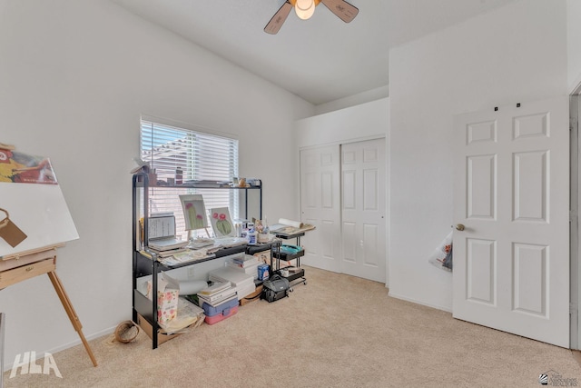 interior space featuring light carpet and ceiling fan