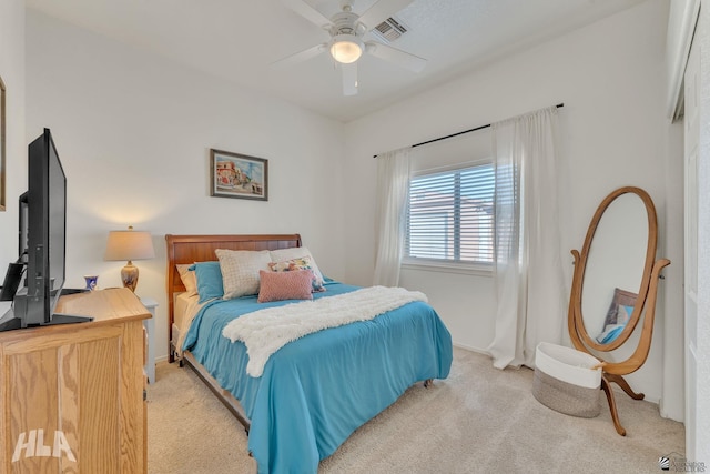 carpeted bedroom with ceiling fan