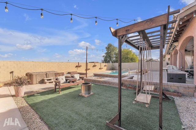 view of yard with a fenced in pool, a pergola, and a patio area