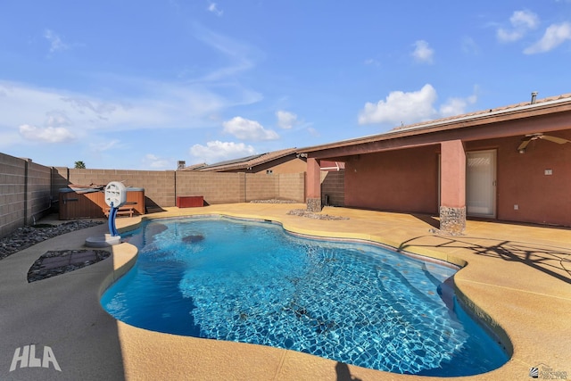 view of swimming pool with a fenced backyard, ceiling fan, and a patio