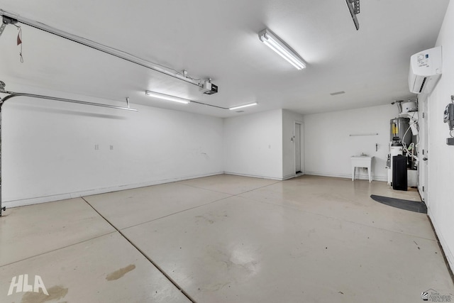 garage with a garage door opener, a wall unit AC, and a sink