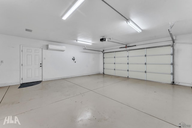 garage with a wall unit AC and a garage door opener