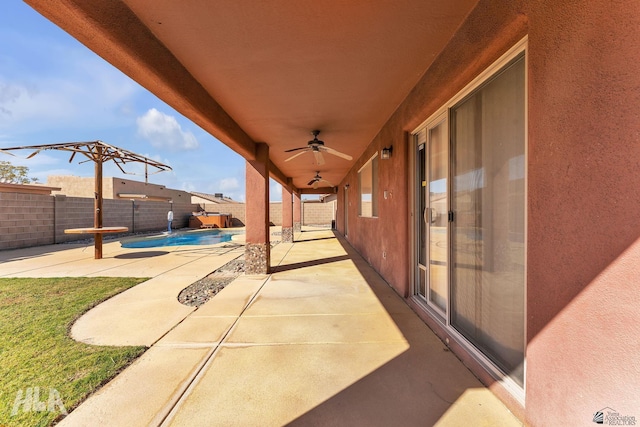 view of patio / terrace featuring a fenced backyard, a ceiling fan, and a fenced in pool