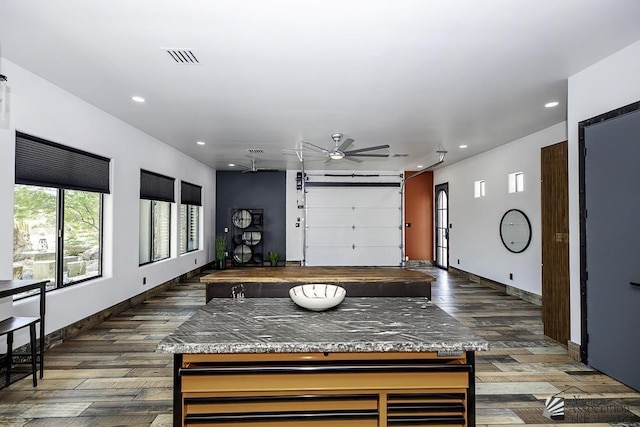 garage with ceiling fan and beverage cooler