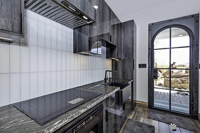 kitchen featuring tile walls, dark hardwood / wood-style flooring, custom range hood, and oven