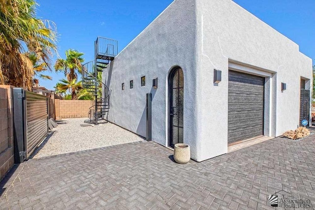 view of property exterior featuring a garage