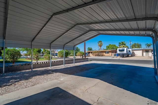 view of pool with a carport