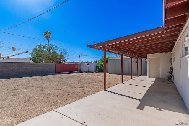 view of patio / terrace featuring a storage unit