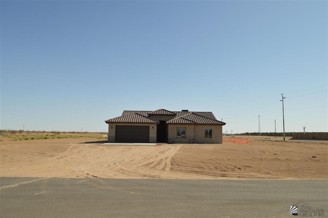 view of front of property featuring a garage