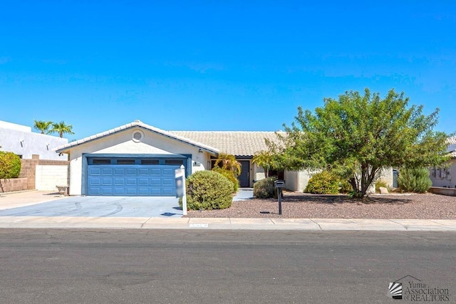 ranch-style home featuring a garage