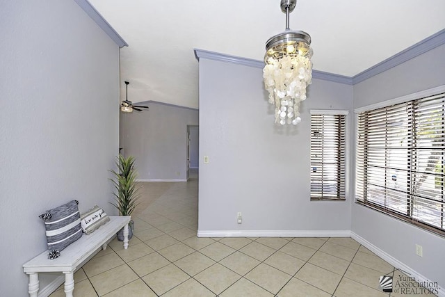 dining area with crown molding, ceiling fan with notable chandelier, and light tile patterned floors