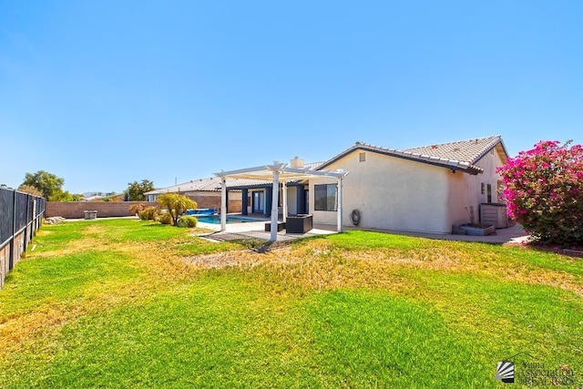 rear view of house with a yard, a patio area, and a pergola