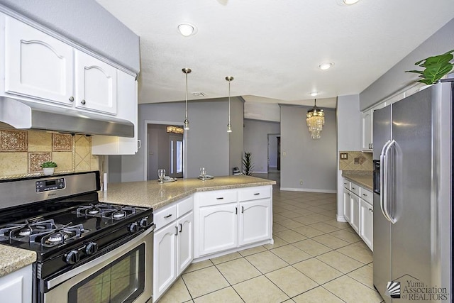 kitchen with light tile patterned flooring, appliances with stainless steel finishes, pendant lighting, tasteful backsplash, and white cabinets