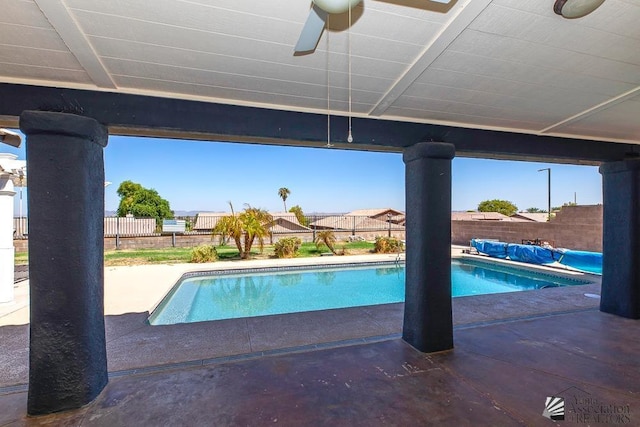 view of pool featuring ceiling fan and a patio area