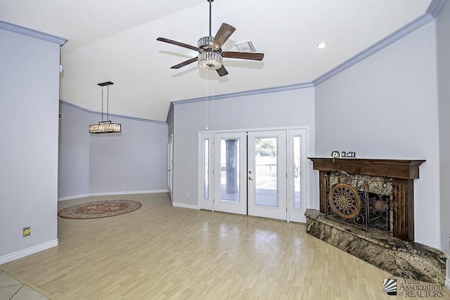 living room with ceiling fan, ornamental molding, vaulted ceiling, and light wood-type flooring