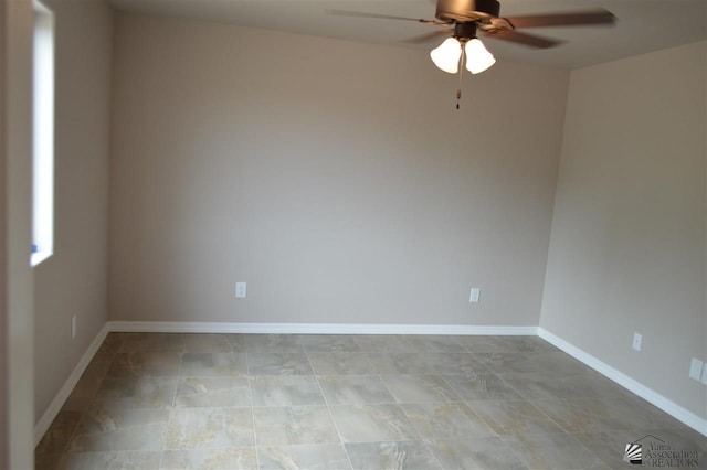 spare room with ceiling fan