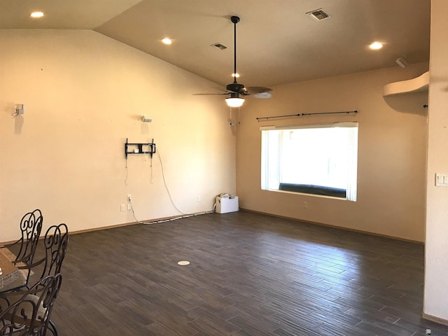 spare room featuring dark hardwood / wood-style floors, ceiling fan, and lofted ceiling