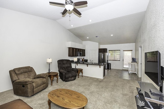 living room with baseboards, lofted ceiling, recessed lighting, ceiling fan, and dark colored carpet