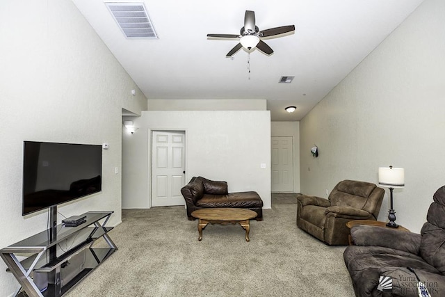 living area featuring visible vents, ceiling fan, and carpet floors