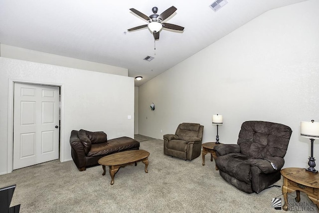 carpeted living area featuring lofted ceiling, visible vents, and ceiling fan