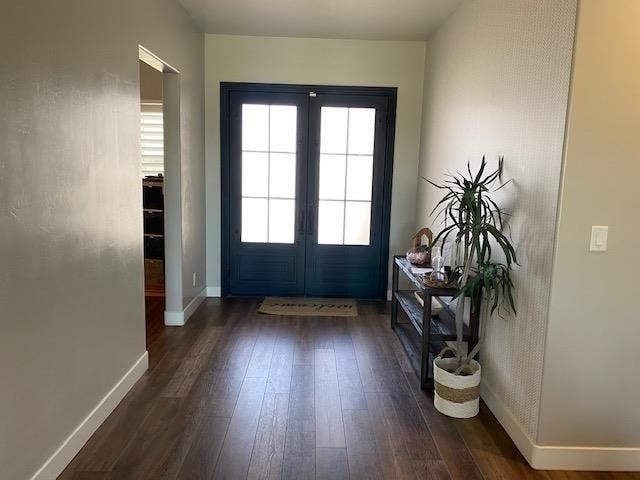 doorway featuring french doors and dark hardwood / wood-style floors