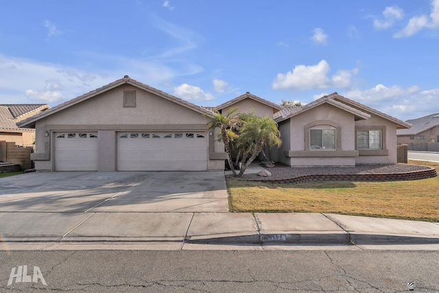 single story home with a garage and a front yard