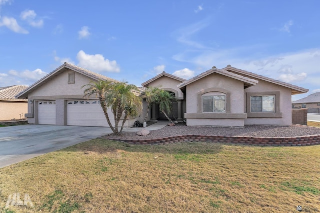 view of front of house featuring a garage and a front yard