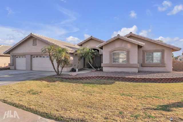 view of front facade featuring a garage and a front lawn