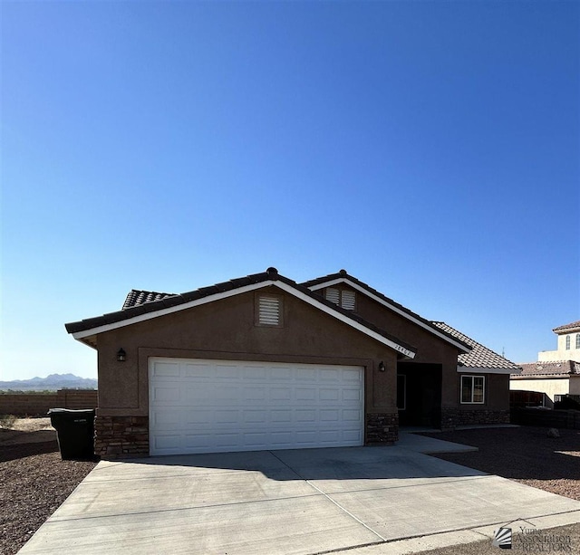 single story home featuring a garage