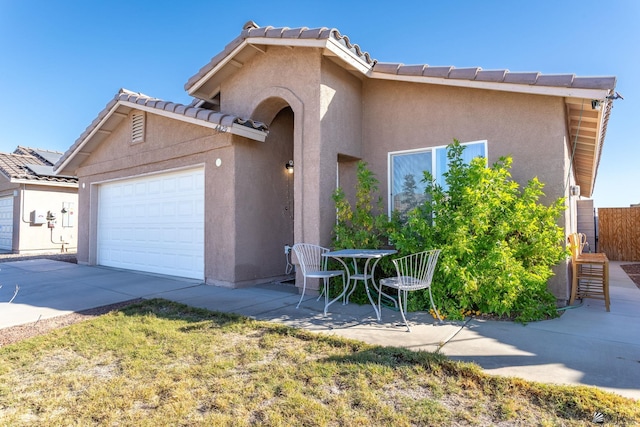 view of front of property with a garage