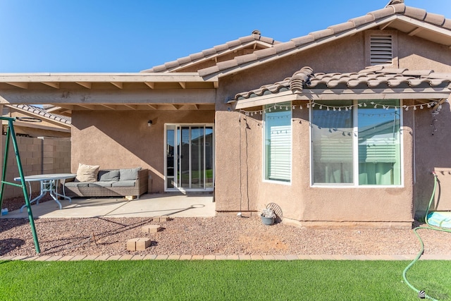 rear view of property with a patio