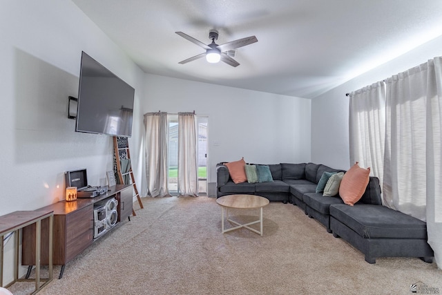 living room with ceiling fan, light colored carpet, and lofted ceiling