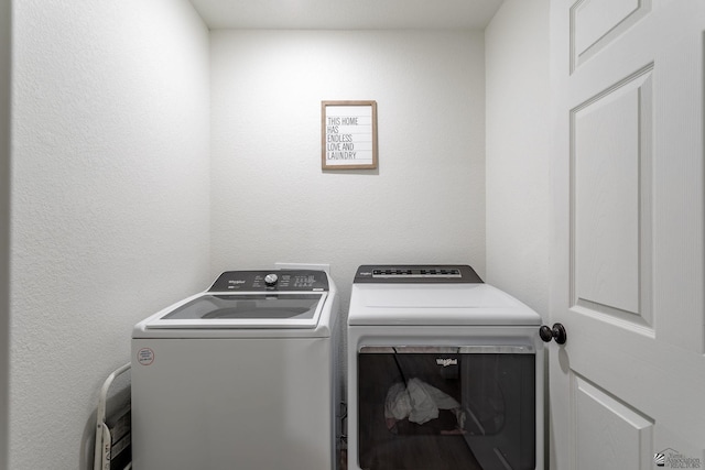 washroom featuring washing machine and dryer