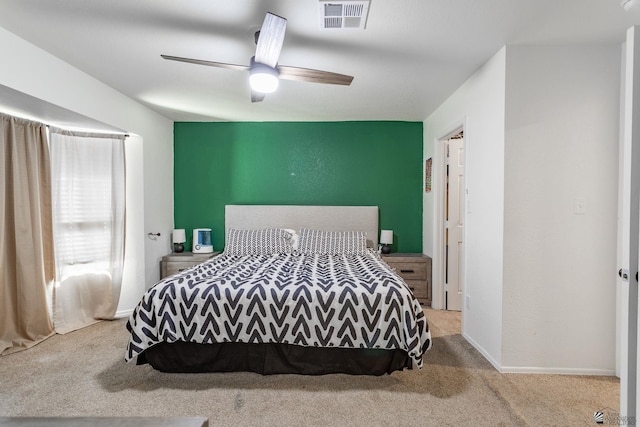 bedroom with light carpet and ceiling fan