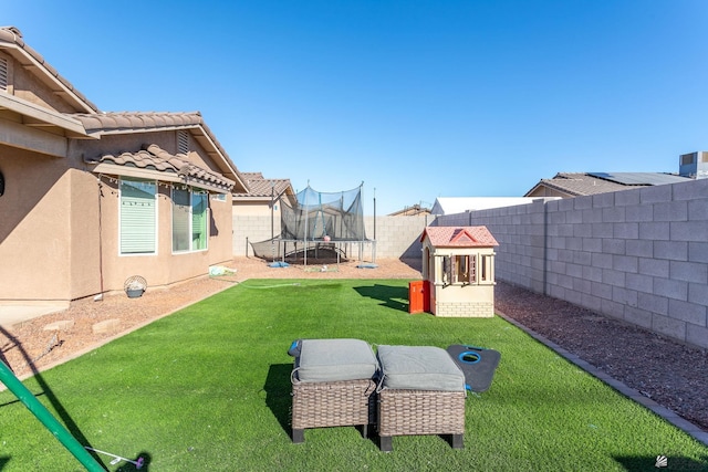 view of yard with a trampoline