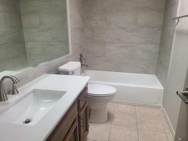 full bathroom featuring vanity, tiled shower / bath combo, tile patterned floors, and toilet